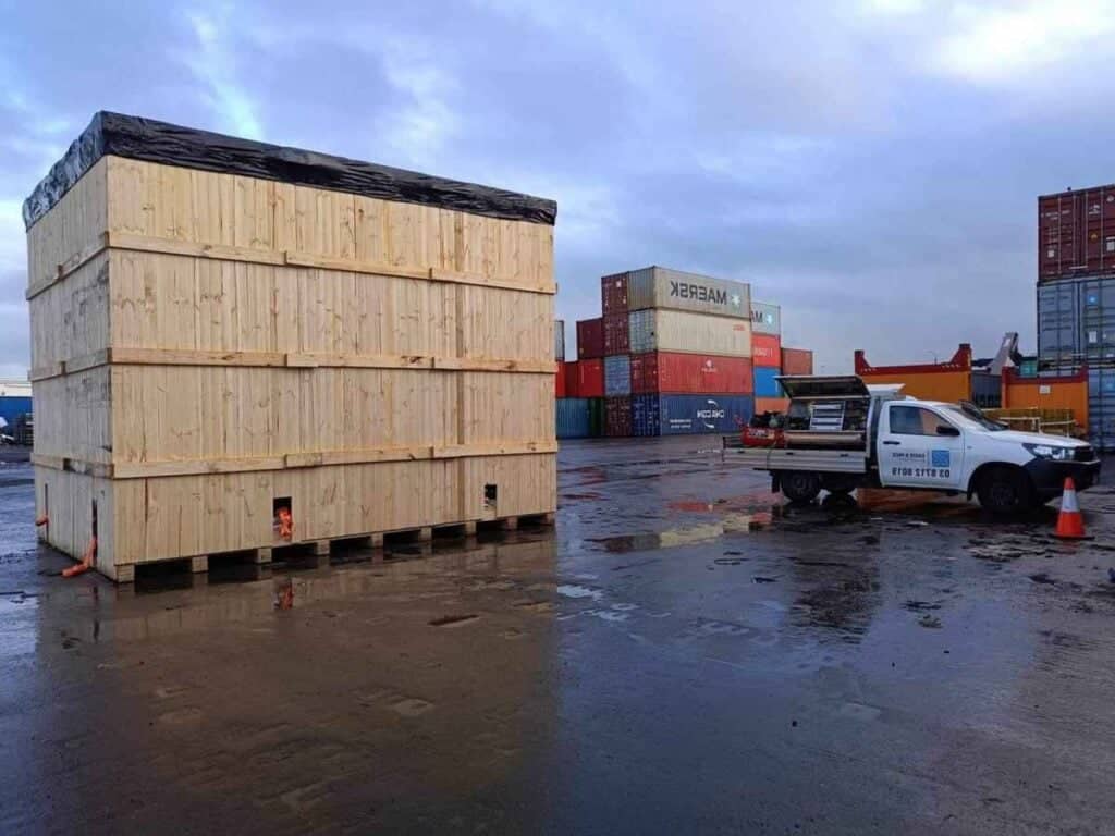 large wood shipping case with crate n pack solutions branded ute and shipping containers in background (15)