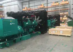 Cummins generator with plywood boxes on the side and Crate n Pack Solutions logo in background