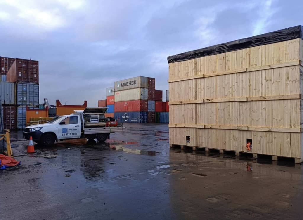 large wood shipping case with crate n pack solutions branded ute and shipping containers in background (11)